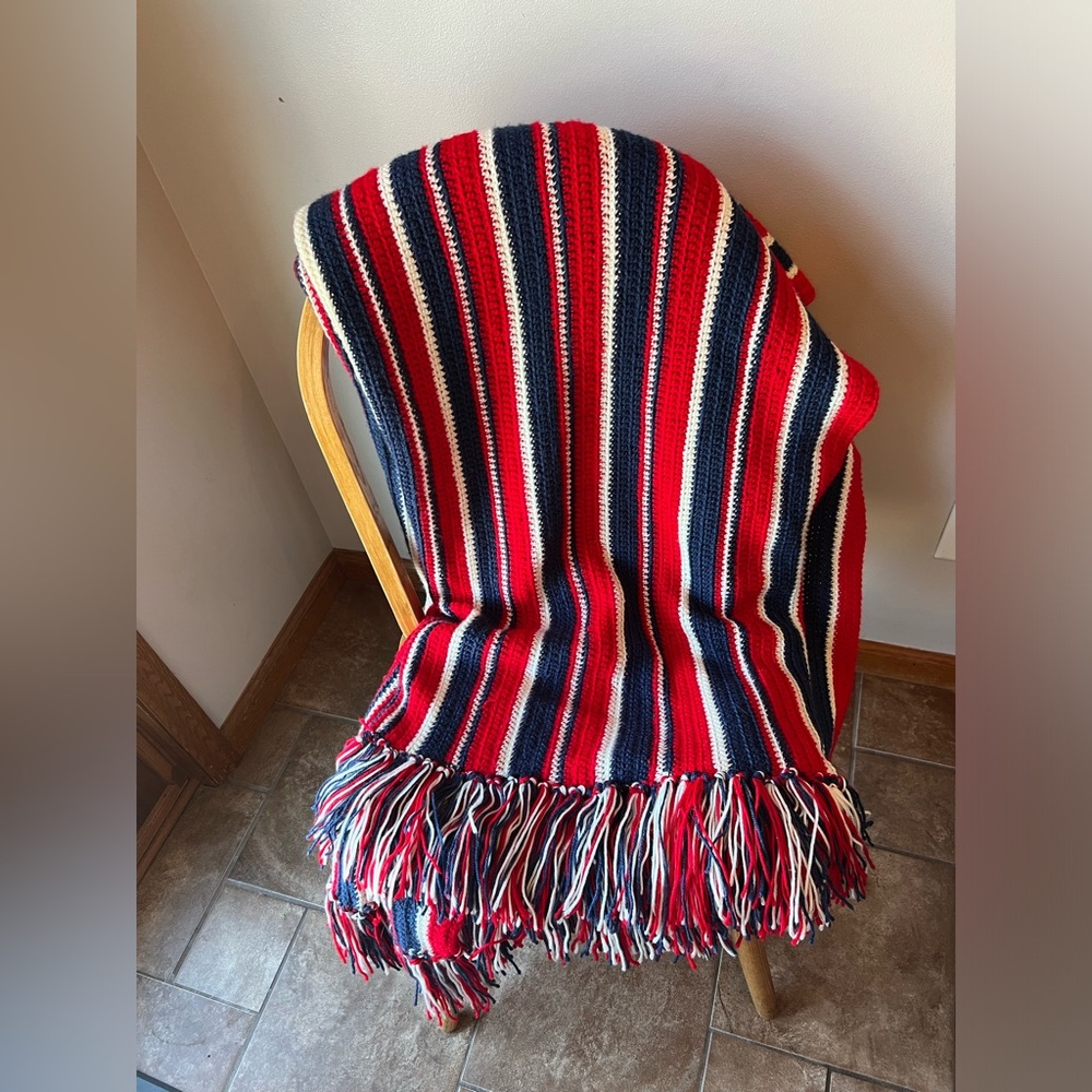 red, white and blue crocheted afgan